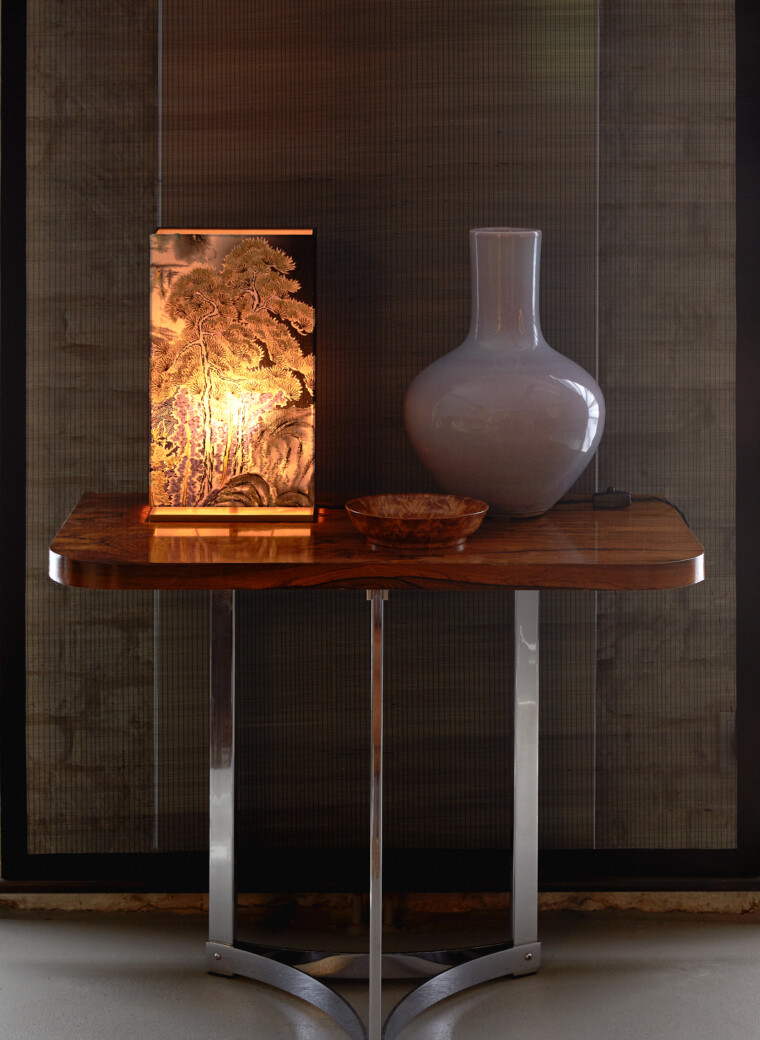 Lamp with a handcrafted decorative fabric shade on a solid brass base